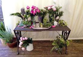 Table of vintage items and traditional flowers