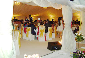 Dining inside a large wedding marquee