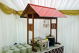 Food stations with traditional roofs and carvings
