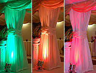 Colour changing lighting applied to draped poles