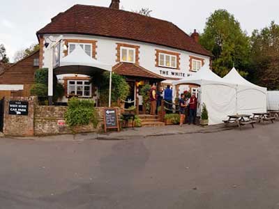 Customers congregating outside the White Horse pub