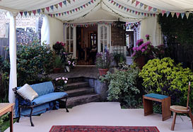 Marquee attached to the house and spanning garden decking