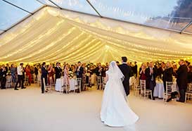 Bride and groom enter their reception marquee