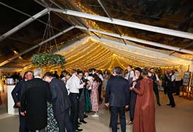 Wedding tent covered with transparent roof and opaque roof with fairy lights