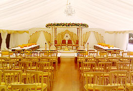 Marquee laid out for wedding with wedding mandap