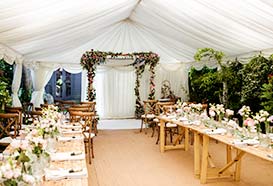 Marquee laid out for Jewish wedding ceremony and reception