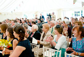 Guests watch the wedding ceremony