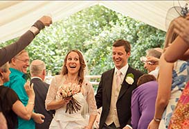 Happy couple after a personalised marquee wedding ceremony