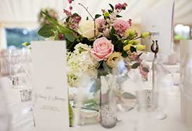 Floral centrepiece with James Bond themed table names