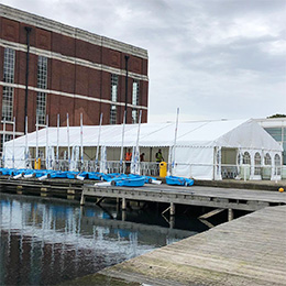 Temporary structure on decking alongside a boating lake