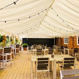 Temporary restaurant in tent on decking