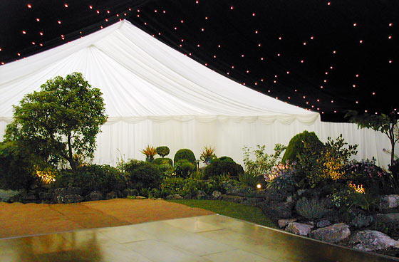 Marquee built around a large well-planted garden