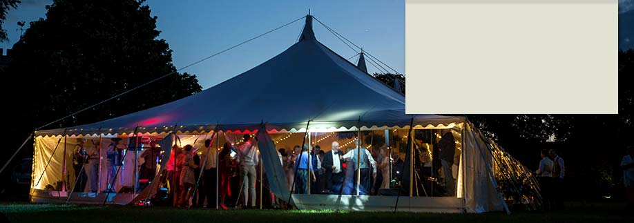 Wedding reception in traditional style marquee, Buckinghamshire